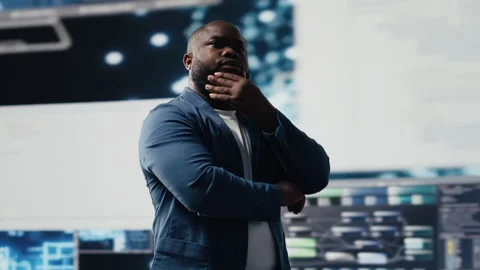 Black programmer expert engaging in software development at high tech workspace Stock Footage 312413757