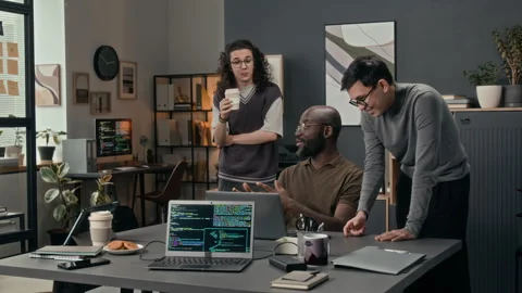 Black Programmer Looking at Laptop Explaining His Vision to Caucasian Colleague Stock-Footage 329613642