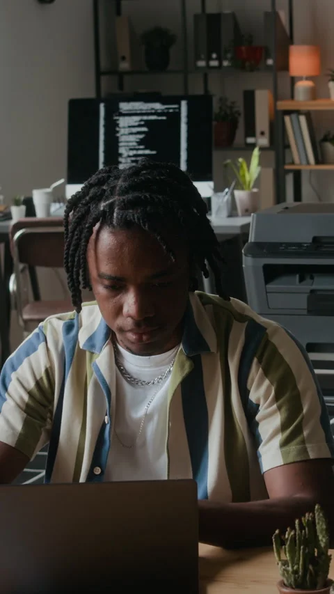 Black Programmer Working on Laptop in Office Stock Footage 306741633