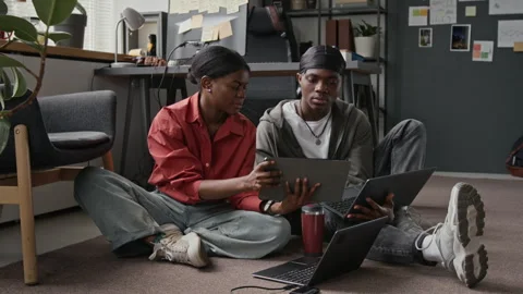 Black Programmers Using Tablet for Coding in Startup Office 動画素材 336717762