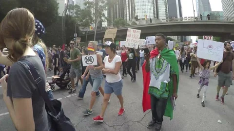 Black Protester Draped In Rainbow Cape Defends Transgender Rights Video stock 225410335