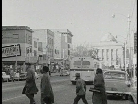 Black protestors are peacefully protest at a Woolworth and are arrested in the Stock Footage 75291208