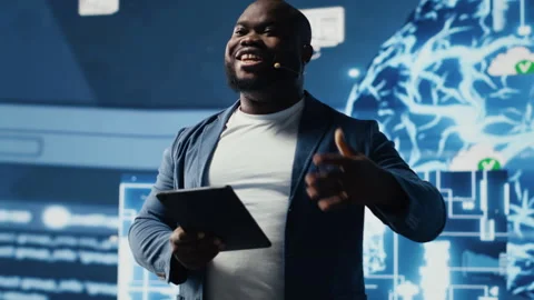 Black public speaker host presenting AI neural networks at live event Stock Footage 312303421