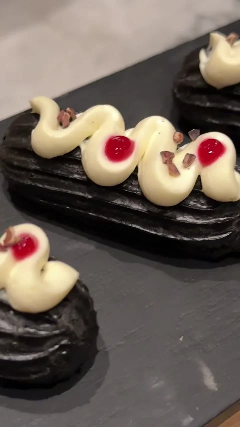 Black pudding cakes Serving chocolate brownie with vanilla ice cream scoop. Chef Stock Footage 311875637