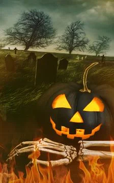 Black pumpkin with skeleton hand with graveyard Stock Photos