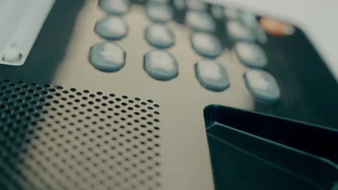 Black push-button old telephone with the receiver removed and lying nearby Stock Footage 287937625