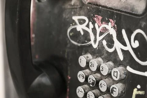 Black push-button public payphone close-up Stock Photos