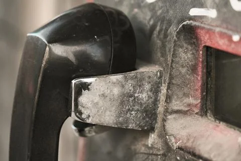Black push-button public payphone close-up Stock Photos