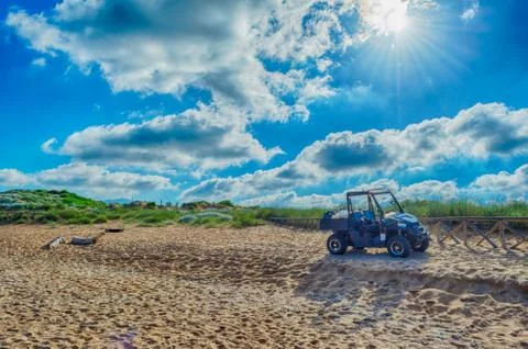 Black quad on the beach Stock Photos