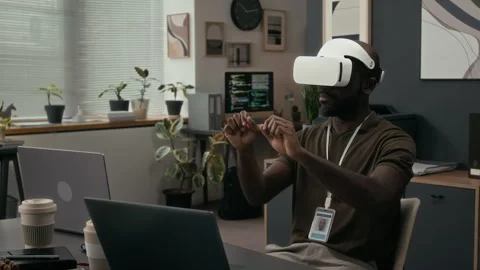 Black Quality Assurance Engineer Evaluating Software Product Using VR Headset Stock Footage 329614295