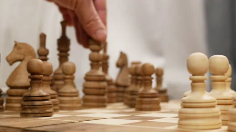 The black queen moves from the blurred side of the chess board Stock Footage 147075014