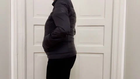 Black Quilted Jacket Review: Materials, Comfort, and Sizing Guide Video stock 324417401