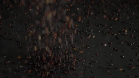 Black quinoa falls on a black background Stock Footage 106707702