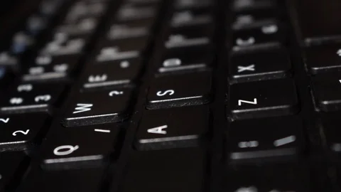 Black QWERTY keyboard rack focus Stock Footage 82975997
