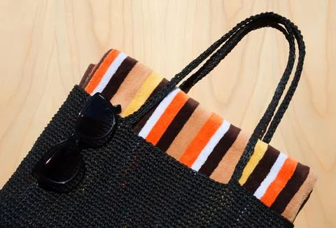 Black raffia beach bag. Stock Photos