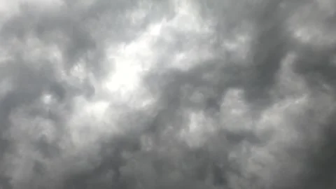 Black rain clouds covered the sky with.Dramatic moving dark storm clouds mo.. Video stock 259835966