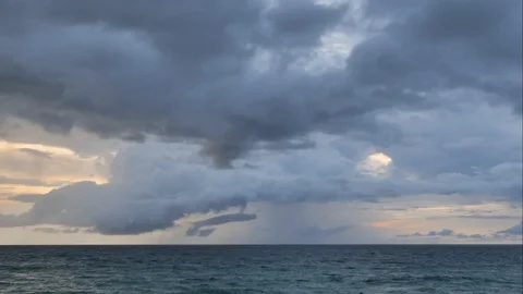 The black rain clouds were moving slowly at sunset time. Stock-Footage 118592508