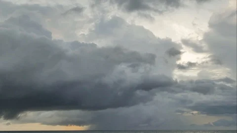 The black rain clouds were moving slowly at sunset time. Stock-Footage 118592906