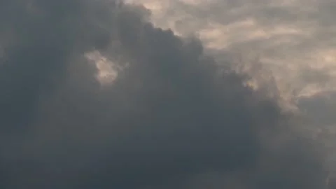 Black raincloud cover on grey cloud on evening cloudy sky Stock Footage 239528592