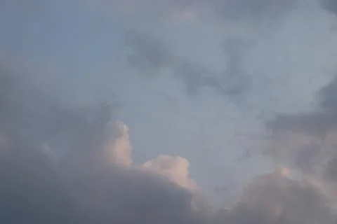 Black rainy clouds in blue sky before the rain. Dark blue stormy cloudy sky Stock Photos