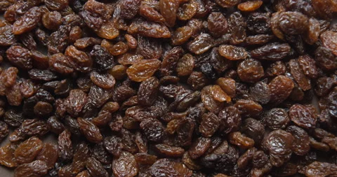 Black raisins close up studio shot over rotating Stock-Footage 324841745