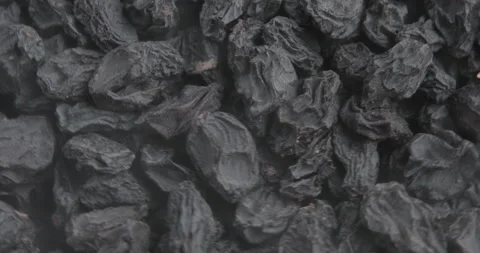 Black raisins rotates on the turntable. Stock Footage 97906817