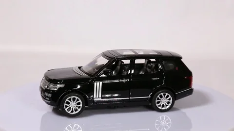 Black Range Rover scale model SUV car is rotating. Stock Footage 101728199