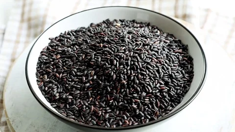 Black raw rice Stock Footage 88822899