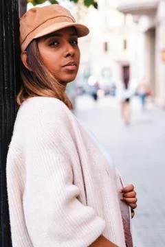 Black real woman looking at camera in autumn clothes Stock Photos