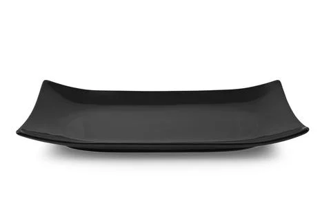 Black rectangle ceramic plate isolated on white background. Stock Photos