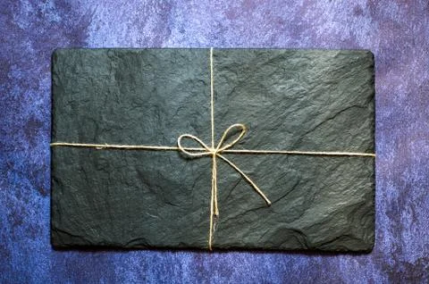 Black rectangular slate board on a blue background. Restaurant fittings Stock Photos