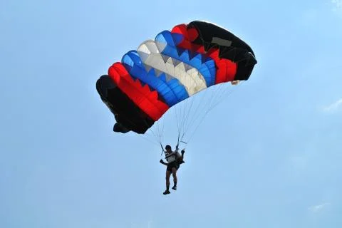 Black red blue white parachuter Stock Photos