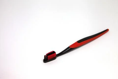 Black red toothbrush on the table Stock Photos
