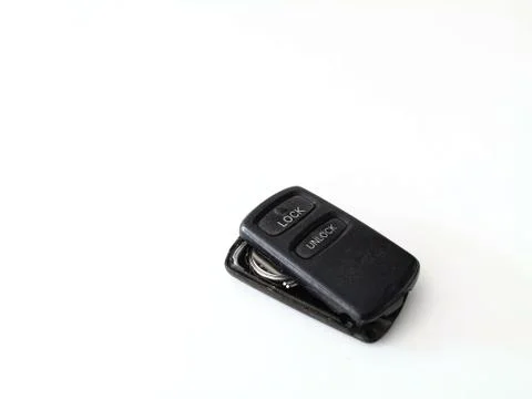The black remote control has two buttons with lock and unlock for car, gate, Stock Photos