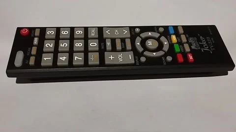 This black remote is used to view television shows Stock Footage 225071774