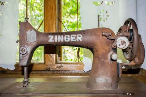 Black retro sewing machine in an old house Stock Photos