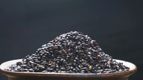 Black rice on a black background Stock Footage 98936451