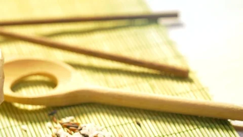 Black rice grains dropping down into a paper food bag Stock Footage 69725000