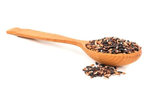 Black rice in a spoon Stock Photos