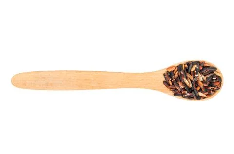 Black rice in a spoon Stock Photos
