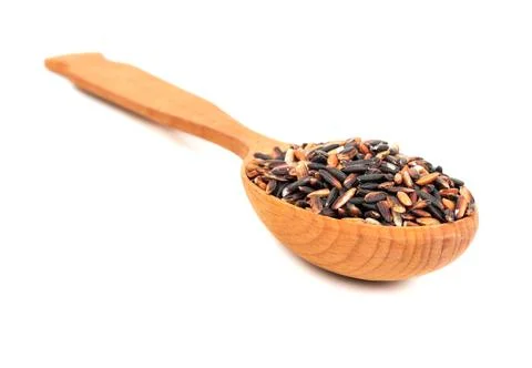 Black rice in a spoon Stock Photos
