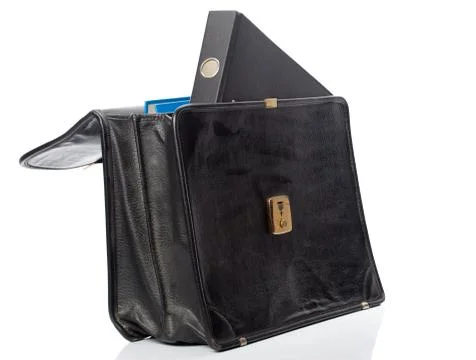 Black ring binder in an open briefcase Stock Photos