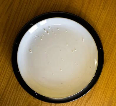 Black Ringed Plate Top Down With Crumbs Stock Photos