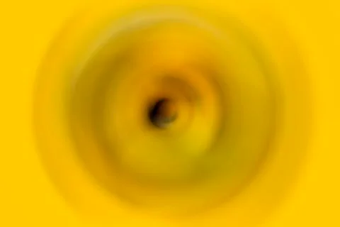The black ripple effect in the yellow-colored solid background. Stock Photos