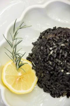 Black risotto and squid Stock Photos