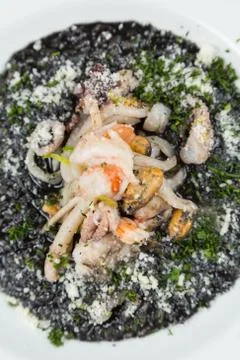 Black risotto with seafood Stock Photos