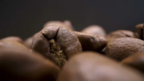 The black roasted coffee beans on the table Stock Footage 135702996