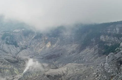 Black rock formations inside a volcano caldera Stock-Fotos