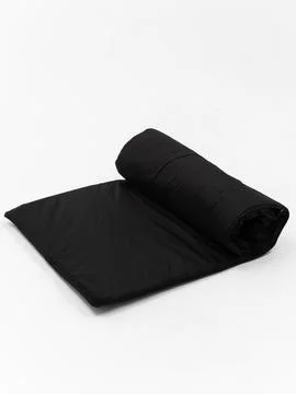 Black rolled sleeping bag variant two Stock Photos