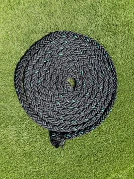 Black Rope Coiled Into A Circle Stock Photos
